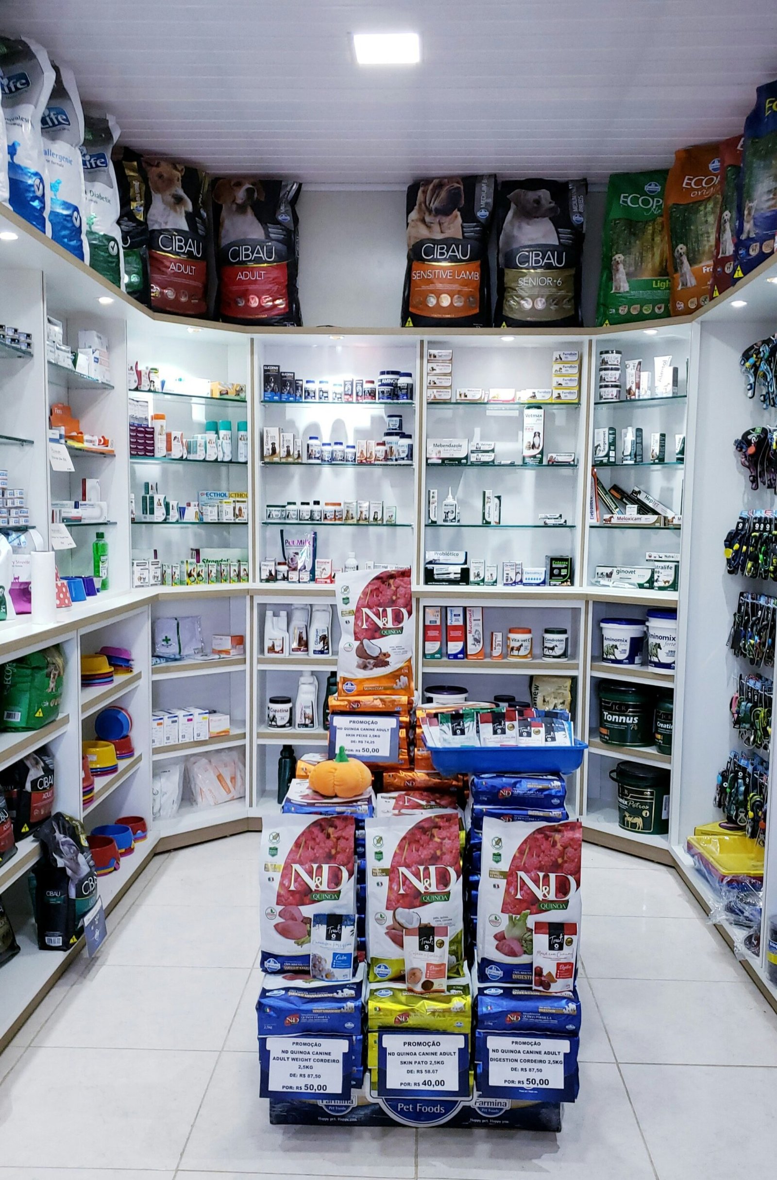 assorted food cans on white shelf